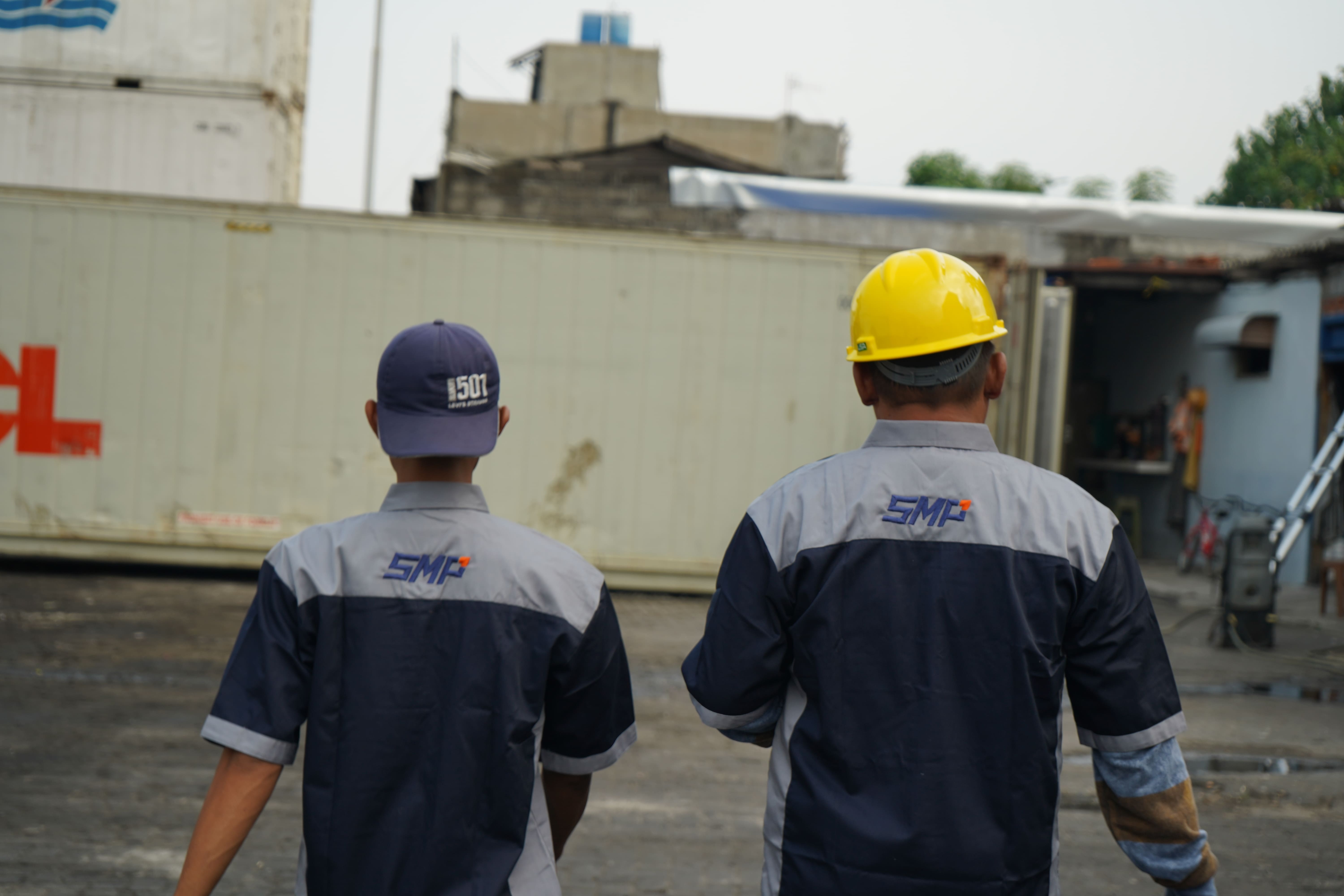 SMP workers walking at container yard